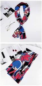 Detail view of long skinny silk scarf featuring vibrant blue red black floral abstract print.
