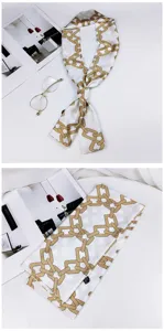Elegant long skinny silk scarf with chic gold chain print, perfect for neck or bag handle styling.