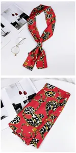 Red long silk scarf with gold chain and leopard print, perfect for bag strap or neck wear.