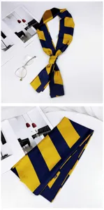 Detailed view of the elegant blue and yellow silk twilly scarf, perfect for bags or hair styling.