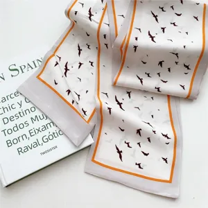 Elegant slim silk scarf with chic bird print and orange border, perfect for women's wear.