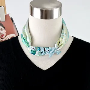 Silk scarf detail shot, artistic oil painting print, elegant neckerchief texture view.
