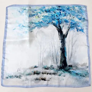 Detailed close-up view of the elegant blue oil painting style mulberry silk square scarf.