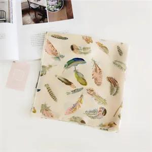 Chic feather print square silk scarf, lightweight elegant neckerchief for women styling detail.