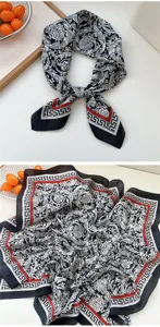 Detailed view of the 70x70cm baroque silk square scarf, featuring elegant black, white and red patterns.