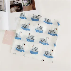Elegant small square silk scarf with charming swan print, perfect for neckwear and styling.