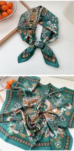 Detailed view of a 70x70cm green square silk scarf with exquisite floral paisley print for women.
