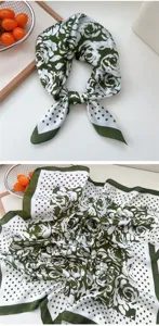 Green and white floral polka dot silk scarf detail view, showing exquisite print and fabric.