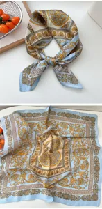 Elegant light blue square silk scarf featuring luxury baroque gold print and classic geometric border.