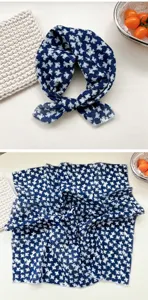 Detailed view of dark blue floral cotton square scarf, soft neckerchief and head wrap.