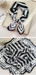 Foulard quadrato in seta nera e bianca con stampa di stelle, accessorio elegante.
