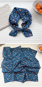 Detailed view of the blue floral cotton small square scarf, showing delicate floral pattern.