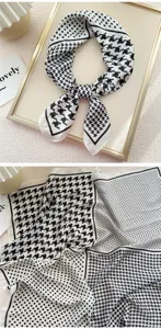 Elegante foulard in seta con motivo pied-de-poule e pois in bianco e nero classico.