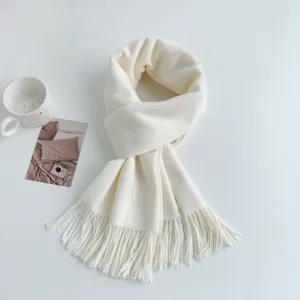 Cozy imitation cashmere solid color tassel scarf for women, soft winter fashion accessory.