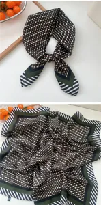 Detail view of the 70x70cm square silk scarf featuring geometric plaid and striped pattern.