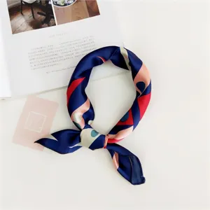 Detailed view of women's 50cm square silk scarf with abstract geometric print for chic style.