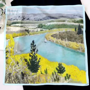 Detailed view of luxury style landscape printed silk square scarf, exquisite fine texture fabric.