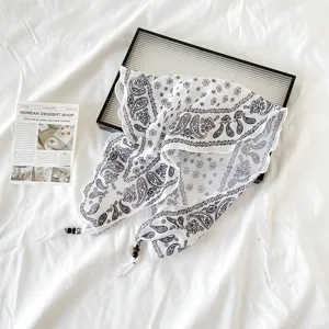 Retro paisley print triangular linen scarf, black and white bandana with beaded tassel details.