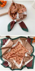 Details of the luxury silk square scarf featuring elegant H monogram print in orange and green.