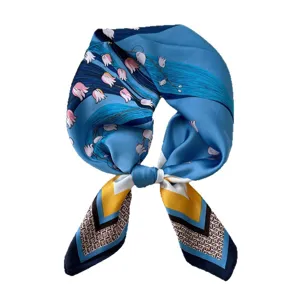 Luxury blue silk square scarf for women, elegant floral design tied shape, spring neck accessory.