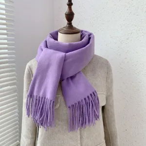Cozy purple imitation cashmere scarf with fringe, elegant winter warm neckwear detail shot.