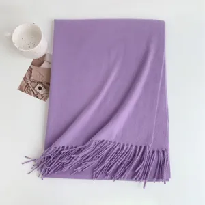 Elegant purple cashmere-feel winter tassel scarf, cozy solid color design for women.