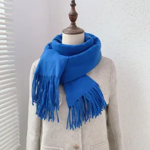Royal blue imitation cashmere fringe scarf detail, warm winter solid color fashion accessory.
