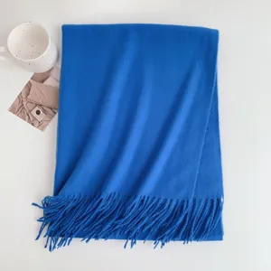 Classic solid blue cashmere-feel winter fringed scarf for women, elegant and warm daily wear.