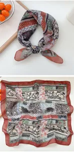 Detailed close-up showing the vintage paisley and floral patchwork pattern of the square scarf.
