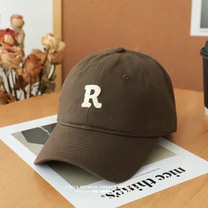 Brown baseball cap for men and women, classic soft top hat with white letter R embroidery.