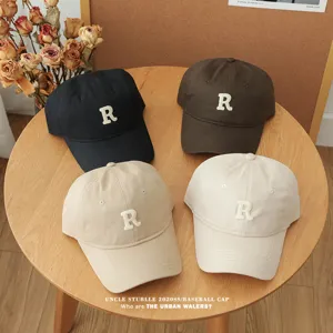 Unisex soft-top baseball cap with letter R embroidery available in four classic colors.