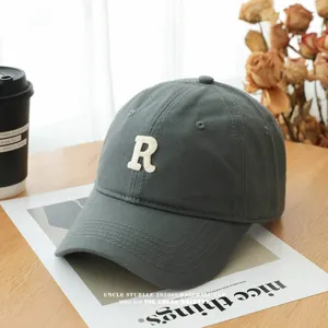 Classic dark grey baseball cap with white embroidered R letter, soft top casual unisex hat for daily wear.