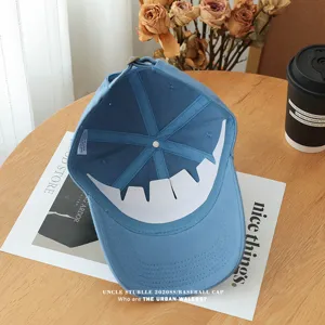 Light blue soft top baseball cap detail view, showing interior six-panel structure and breathable design.