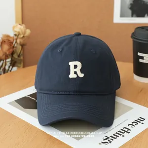 Unisex navy blue baseball cap with white embroidered R letter, soft top casual daily wear hat.