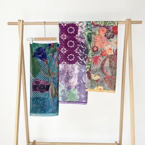 Retro printed silk cotton scarf detail showcasing colorful artistic floral and geometric patterns.