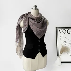 Detailed view of vintage paisley print silk blend square scarf draped on mannequin, elegant.