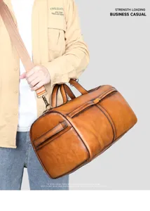 Retro brown leather duffel bag detail, premium top-layer cowhide travel shoulder bag.