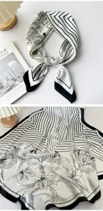 Silk scarf with chic black and white stripe and floral pattern for elegant daily wear.