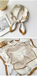 Detail view of the elegant white and brown striped silk square scarf featuring chic letter print.