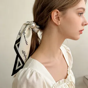Silk scarf hair scrunchie with magnetic pearl buckle, elegant minimalist hair accessory for women.