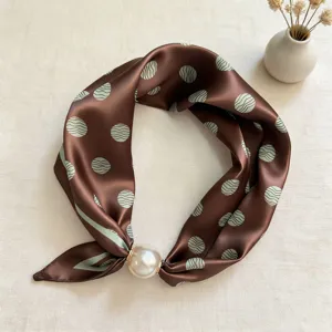 Elegant brown silk scarf featuring a pearl magnetic clasp and unique wave dot pattern.