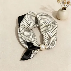 Elegant black and white striped triangular silk scarf with pearl detail, chic accessory for shirts.
