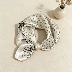 Chic black and white geometric silk scarf with elegant pearl magnetic clasp detail.