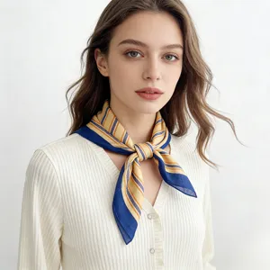 Detailed shot of a blue and yellow striped square scarf worn by a model in white top.