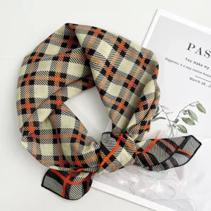 Close-up detail of the cotton geometric plaid square scarf, featuring stylish pattern texture.