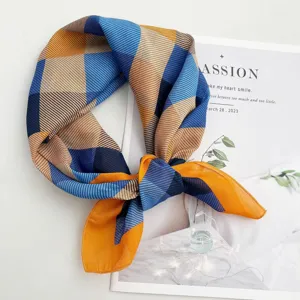 Detailed view of a stylish geometric striped square scarf featuring blue, yellow, and brown tones.