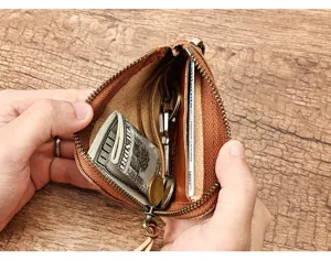Mini leather coin purse with key ring and zipper, brown cowhide wallet for daily use.