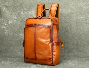 Detailed view of the premium leather backpack featuring exquisite stitching, sturdy top handle and zipper.