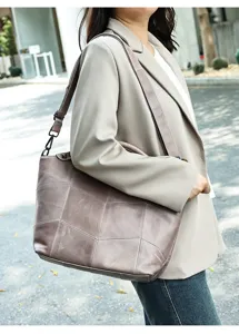 Genuine leather patchwork shoulder bag detail showing premium texture and exquisite craftsmanship.
