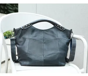 Gray blue leather patchwork handbag detail, casual crossbody design with metal studs.